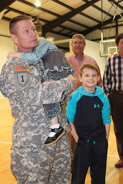 Surprise homecoming, a local hero returns to his family