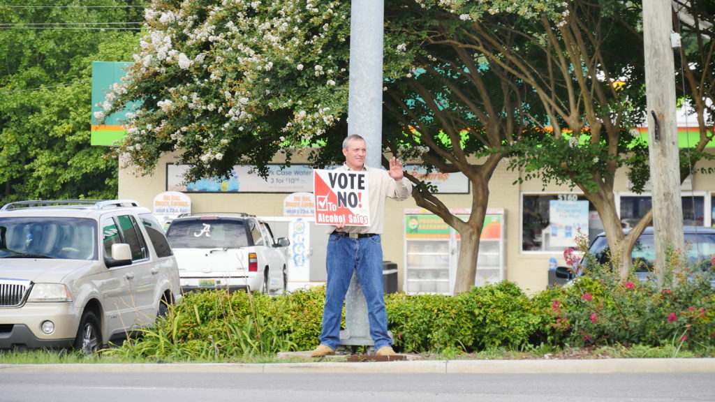 Citizen Wes McBride, pastor at Central Baptist Church, helps get the "No" message out on Monday before polls open. (Photo by Tyler Pruett)