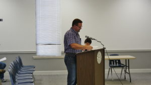 County Engineer Ben Luther, P.E., presents bid submissions for road work materials. (Photo by Tyler Pruett) 