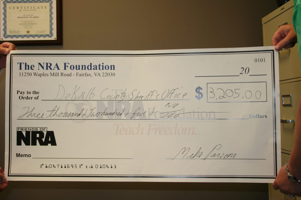 Check from the Friends of NRA Foundation. (Photo courtesy of the DeKalb County Sheriff's Office)