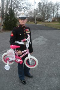 Lance Corporal Landon Fant with a donated bike. (LaRue Hardinger | NE AL Marine Corps League)